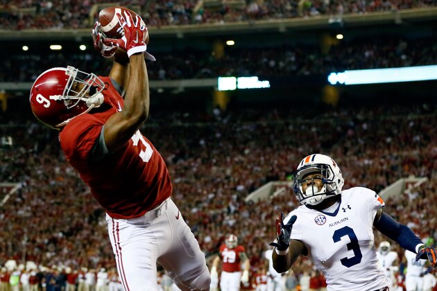 TUSCALOOSA, AL - NOVEMBER 29:  Amari Cooper #9 of the Alabama Crimson Tide catches a 17 yard touchdown pass from Blake Sims #6 in the first quarter against Jonathan Jones #3 of the Auburn Tigers during the Iron Bowl at Bryant-Denny Stadium on November 29, 2014 in Tuscaloosa, Alabama.  (Photo by Kevin C. Cox/Getty Images)