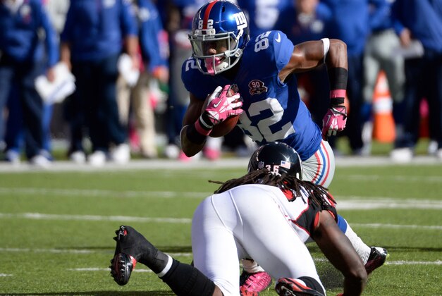 Oct 5, 2014; East Rutherford, NJ, USA; New York Giants wide receiver Rueben Randle (82) runs with the ball against the Atlanta Falcons during the game at MetLife Stadium. Mandatory Credit: Robert Deutsch-USA TODAY Sports