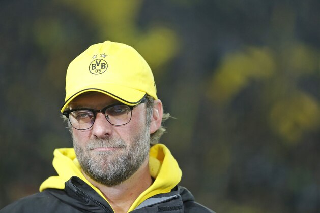 Dortmund's head coach Juergen Klopp grimaces during an interview prior to the German first division Bundesliga soccer match between BvB Borussia Dortmund  and VfL Borussia Moenchengladbach in Dortmund, Germany, Sunday, Nov. 9, 2014. (AP Photo/Frank Augstein)