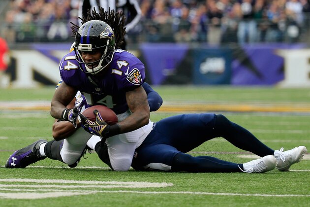 BALTIMORE, MD - NOVEMBER 30:  Wide receiver Marlon Brown #14 of the Baltimore Ravens is tackled by strong safety Marcus Gilchrist #38 of the San Diego Chargers in the first quarter of a game at M&T Bank Stadium on November 30, 2014 in Baltimore, Maryland.  (Photo by Rob Carr/Getty Images)