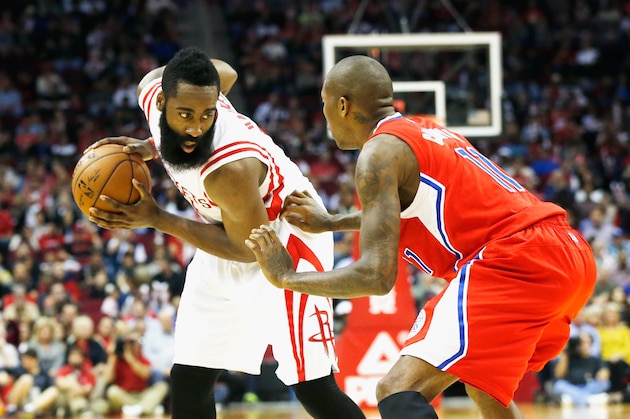 HOUSTON, TX - NOVEMBER 28:  James Harden #13 of the Houston Rockets looks to drive on Jamal Crawford #11 of the Los Angeles Clippers during their game at the Toyota Center on November 28, 2014 in Houston, Texas.  NOTE TO USER: User expressly acknowledges and agrees that, by downloading and/or using this photograph, user is consenting to the terms and conditions of the Getty Images License Agreement.  (Photo by Scott Halleran/Getty Images)
