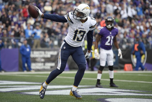 San Diego Chargers wide receiver Keenan Allen (13) celebrates his touchdown in front of Baltimore Ravens cornerback Lardarius Webb in the first half of an NFL football game, Sunday, Nov. 30, 2014, in Baltimore. (AP Photo/Nick Wass)