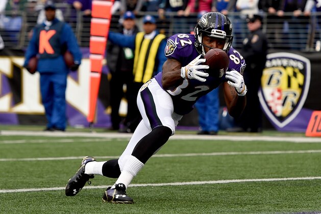 BALTIMORE, MD - NOVEMBER 30:  Wide receiver Torrey Smith #82 of the Baltimore Ravens catches a touchdown in the first quarter of a game against the San Diego Chargers at M&T Bank Stadium on November 30, 2014 in Baltimore, Maryland.  (Photo by Patrick Smith/Getty Images)