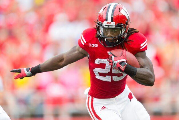 Sep 20, 2014; Madison, WI, USA; Wisconsin Badgers running back Melvin Gordon (25) rushes with the football during the game against the Bowling Green Falcons at Camp Randall Stadium.   Wisconsin won 68-17.  Mandatory Credit: Jeff Hanisch-USA TODAY Sports