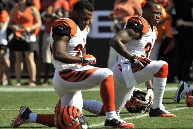 Cincinnati Bengals' Jeremy Hill, right, and Giovani Bernard stretch before their NFL football game against the Tampa Bay Buccaneers Sunday, Nov. 30, 2014 in Tampa, Fla. (AP Photo/Steve Nesius)