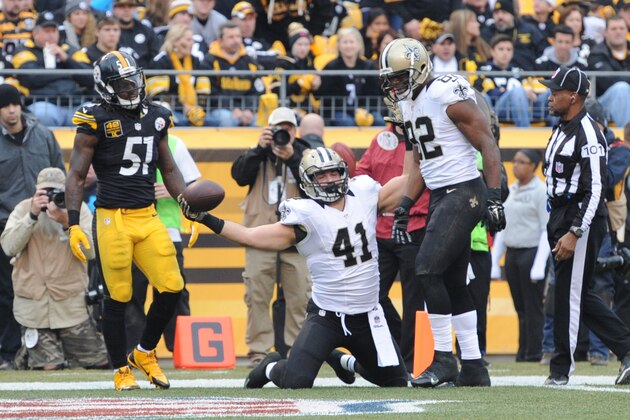 New Orleans Saints fullback Erik Lorig (41) celebrates with tight end Benjamin Watson (82) after making a catch and goes in for a touchdown in the second quarter of the NFL game , Sunday,Nov. 30, 2014 in Pittsburgh. (AP Photo/Don Wright)
