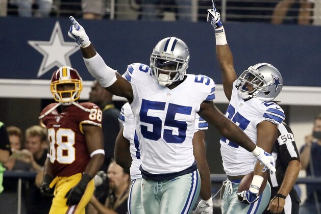 Dallas Cowboys' Rolando McClain (55) and J.J. Wilcox (27) celebrate an interception by Wilcox as Washington Redskins' Pierre Garcon (88) watches during the first half of an NFL football game, Monday, Oct. 27, 2014, in Arlington, Texas. (AP Photo/Brandon Wade)