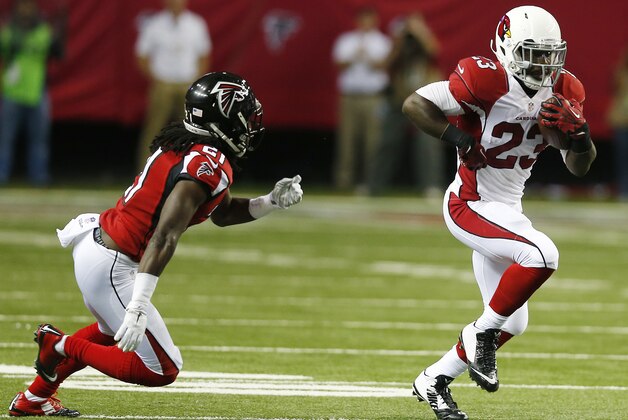 Arizona Cardinals running back Marion Grice (23) runs against Atlanta Falcons cornerback Desmond Trufant (21) during the first half of an NFL football game, Sunday, Nov. 30, 2014, in Atlanta. (AP Photo/John Bazemore)