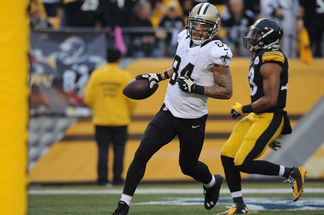 New Orleans Saints wide receiver Kenny Stills (84) left, makes it to the end zone past Pittsburgh Steelers free safety Mike Mitchell (23) for a touchdown after making a catch in the third quarter of the NFL game, Sunday,Nov. 30, 2014 in Pittsburgh. (AP Photo/Don Wright)