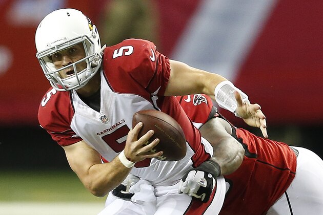 Atlanta Falcons defensive end Jonathan Babineaux hits Arizona Cardinals quarterback Drew Stanton (5) during the first half of an NFL football game, Sunday, Nov. 30, 2014, in Atlanta. (AP Photo/John Bazemore)