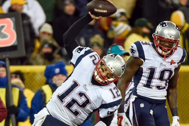 Nov 30, 2014; Green Bay, WI, USA;  New England Patriots quarterback Tom Brady (12) spikes the football after throwing a touchdown pass to wide receiver Brandon LaFell (19) in the second quarter at Lambeau Field. Mandatory Credit: Benny Sieu-USA TODAY Sports