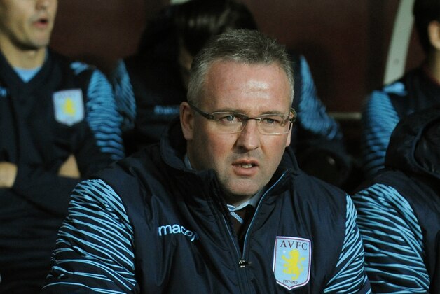 Aston Villa manager Paul Lambert, left, looks on during the English Premier League soccer match between Aston Villa and Southampton at Villa Park, Birmingham, England, Monday, Nov. 24, 2014. (AP Photo/Rui Vieira)