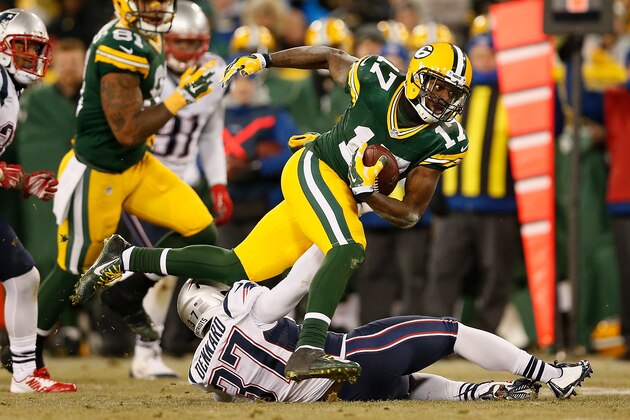 GREEN BAY, WI - NOVEMBER 30:  Wide receiver Davante Adams #17 of the Green Bay Packers runs with the football after a reception past cornerback Alfonzo Dennard #37 of the New England Patriots during the fourth quarter of the NFL game at Lambeau Field on November 30, 2014 in Green Bay, Wisconsin. The Packers defeated the Patriots 26-21.  (Photo by Christian Petersen/Getty Images)