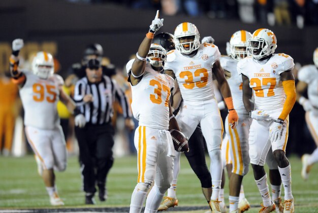 Nov 29, 2014; Nashville, TN, USA; Tennessee Volunteers defensive back Brian Randolph (37) celebrates after an interception during the second half against the Vanderbilt Commodores at Vanderbilt Stadium. The Volunteers won 24-17. Mandatory Credit: Christopher Hanewinckel-USA TODAY Sports