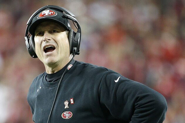 San Francisco 49ers head coach Jim Harbaugh stands on the sideline during the first half of an NFL football game against the Seattle Seahawks in Santa Clara, Calif., Thursday, Nov. 27, 2014. (AP Photo/Tony Avelar)