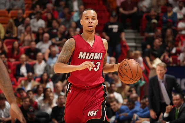 MIAMI, FL - NOVEMBER 25:  Shabazz Napier #13 of the Miami Heat brings the ball up court against the Golden State Warriors on November 25, 2014 at American Airlines Arena in Miami, Florida.  NOTE TO USER: User expressly acknowledges and agrees that, by downloading and or using this Photograph, user is consenting to the terms and conditions of the Getty Images License Agreement. Mandatory Copyright Notice: Copyright 2014 NBAE (Photo by Issac Baldizon/NBAE via Getty Images)