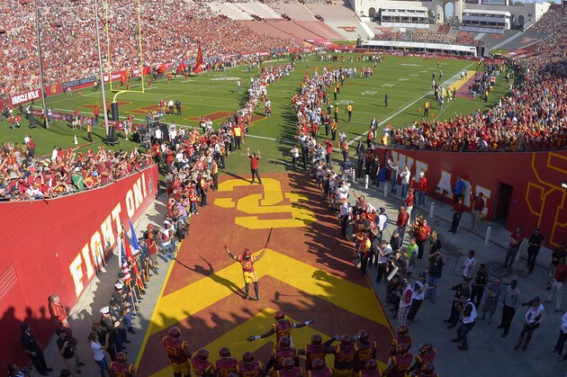 Members of the Southern California team get ready to run onto the field prior to an NCAA college football game against Notre Dame, Saturday, Nov. 29, 2014, in Los Angeles. Southern California won 49-14. (AP Photo/Mark J. Terrill)
