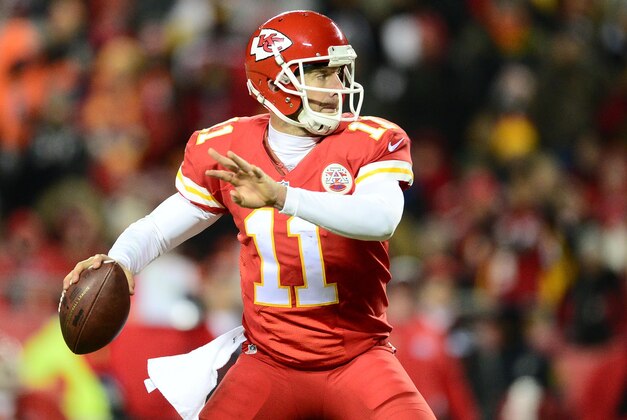 Nov 30, 2014; Kansas City, MO, USA; Kansas City Chiefs quarterback Alex Smith (11) prepares to pass in the second quarter against the Denver Broncos at Arrowhead Stadium. Mandatory Credit: Ron Chenoy-USA TODAY Sports