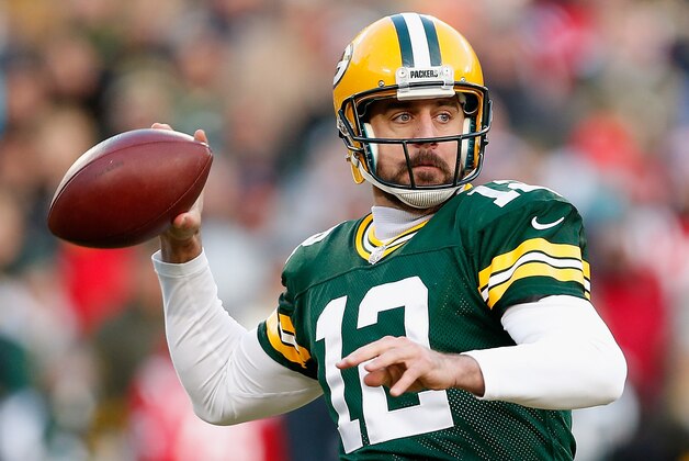 GREEN BAY, WI - NOVEMBER 30:  Quarterback Aaron Rodgers #12 of the Green Bay Packers throws a pass during the first quarter of the NFL game against the New England Patriots at Lambeau Field on November 30, 2014 in Green Bay, Wisconsin. The Packers defeated the Patriots 26-21.  (Photo by Christian Petersen/Getty Images)