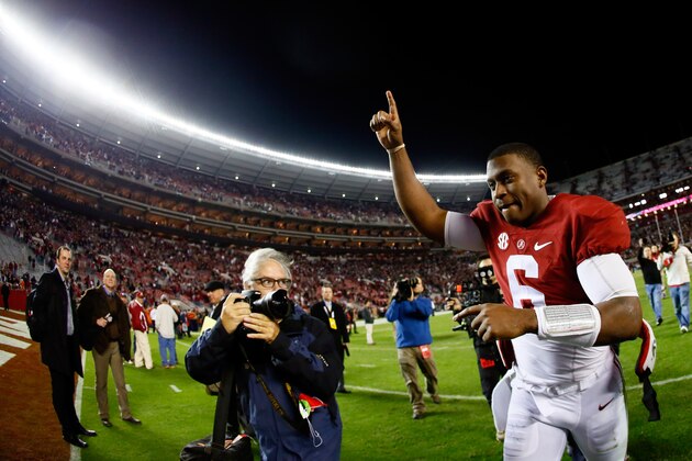 TUSCALOOSA, AL - NOVEMBER 29:  Blake Sims #6 of the Alabama Crimson Tide celebrates as he runs off the field after defeating the Auburn Tigers in the Iron Bowl at Bryant-Denny Stadium on November 29, 2014 in Tuscaloosa, Alabama. The Alabama Crimson Tide defeated the Auburn Tigers 55 to 44.  (Photo by Kevin C. Cox/Getty Images)