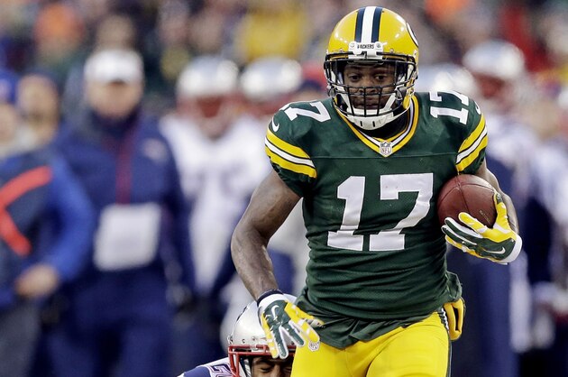 Green Bay Packers' Davante Adams tries to break away from New England Patriots' Logan Ryan during the first half of an NFL football game Sunday, Nov. 30, 2014, in Green Bay, Wis. (AP Photo/Tom Lynn)