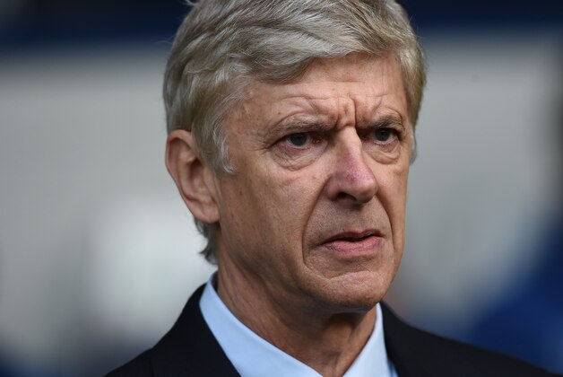 Arsenal’s manager Arsene Wenger looks across the pitch before the English Premier League soccer match between West Bromwich Albion and Arsenal,  at the Hawthorns, in Birmingham, Saturday, Nov. 29, 2014.  (AP Photo/Tim Ireland)
