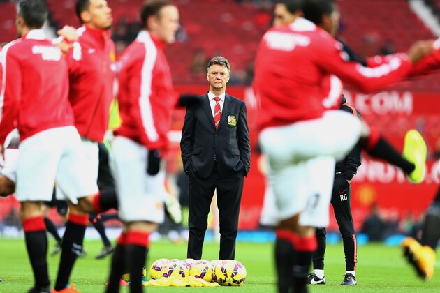 MANCHESTER, ENGLAND - NOVEMBER 29:  Louis van Gaal manager of Manchester United watches players warm up prior to the Barclays Premier League match between Manchester United and Hull City at Old Trafford on November 29, 2014 in Manchester, England.  (Photo by Clive Mason/Getty Images)