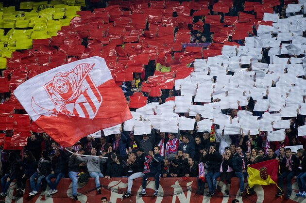 MADRID, SPAIN - JANUARY 11:  Frente Atletico, the Atletico de Madrid ultras, cheer their team with black and white cards prior to the start the La Liga match between Club Atletico de Madrid and FC Barcelona at Vicente Calderon Stadium on January 11, 2014 in Madrid, Spain.  (Photo by Gonzalo Arroyo Moreno/Getty Images)