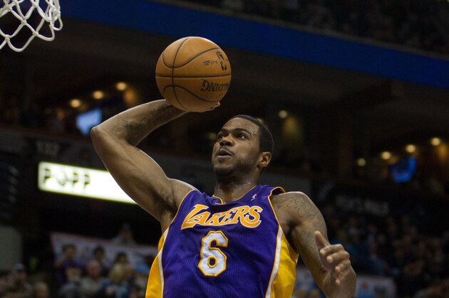 Feb 1, 2013; Minneapolis, MN, USA; Los Angeles Lakers forward Earl Clark (6) dunks during the second quarter against the Minnesota Timberwolves at the Target Center. Mandatory Credit: Brace Hemmelgarn-USA TODAY Sports