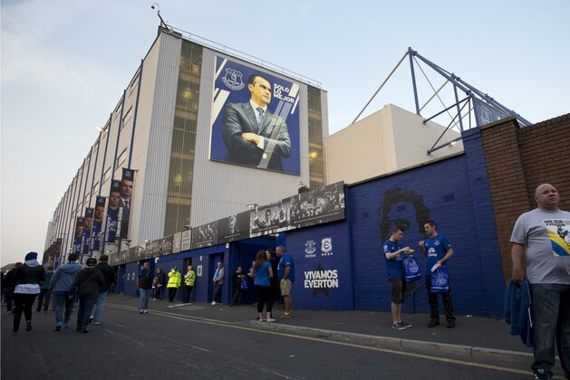 Everton supporter gather at the ground before the team's Europa League Group H soccer match against Wolfsburg at Goodison Park Stadium, Liverpool, England, Thursday Sept. 18, 2014. (AP Photo/Jon Super)