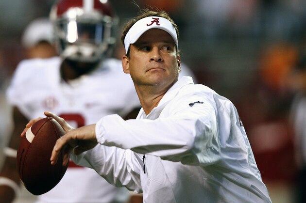 Alabama offensive coordinator Lane Kiffin throws during warmups before an NCAA college football game against Tennessee, Saturday, Oct. 25, 2014 in Knoxville, Tenn. (AP Photo/Wade Payne)