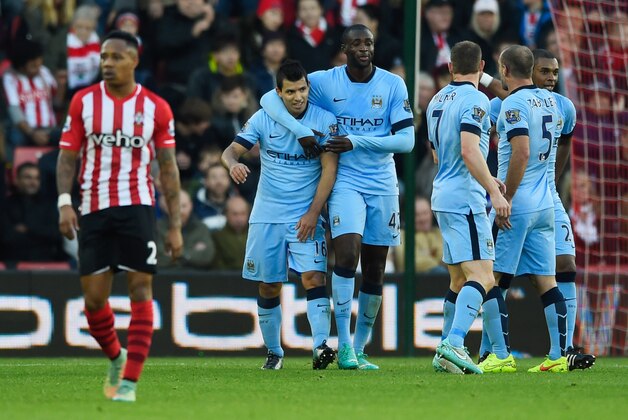 SOUTHAMPTON, ENGLAND - NOVEMBER 30:  Despair for Nathaniel Clyne of Southampton as Sergio Aguero (16) and Yaya Toure (42) celebrate a goal by Gael Clichy of Manchester City (not pictured) for their thir goal during the Barclays Premier League match between Southampton and Manchester City at St Mary's Stadium on November 30, 2014 in Southampton, England.  (Photo by Mike Hewitt/Getty Images)