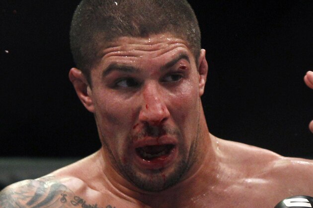 Brendan Schaub, left, and Mirko Cro Cop trade punches during their mixed martial arts match at UFC 128  Saturday, March 19, 2011, in Newark, N.J. Schaub won by KO. (AP Photo/Mel Evans)