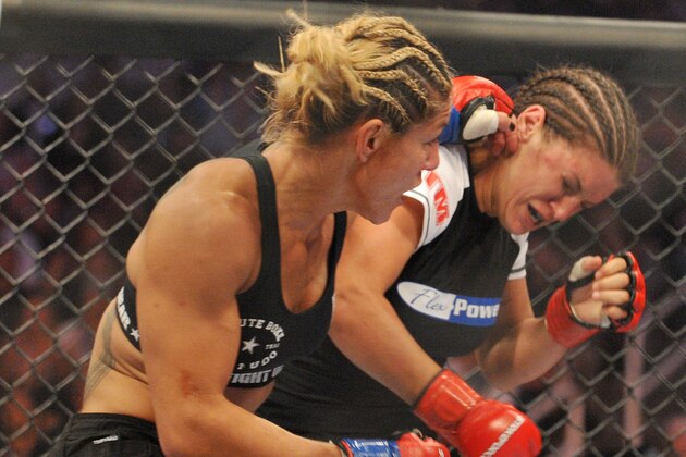 SAN JOSE, CA - AUGUST 15:  Cris Cyborg (L) battles Gina Carano during their Middleweight Championship fight at Stikeforce: Carano vs. Cyborg on August 15, 2009 in San Jose, California.  (Photo by Jon Kopaloff/Getty Images)