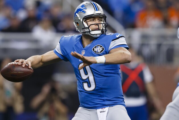 Detroit Lions quarterback Matthew Stafford (9) passes against the Chicago Bears during an NFL football game at Ford Field in Detroit, Thursday, Nov. 27, 2014. (AP Photo/Rick Osentoski)