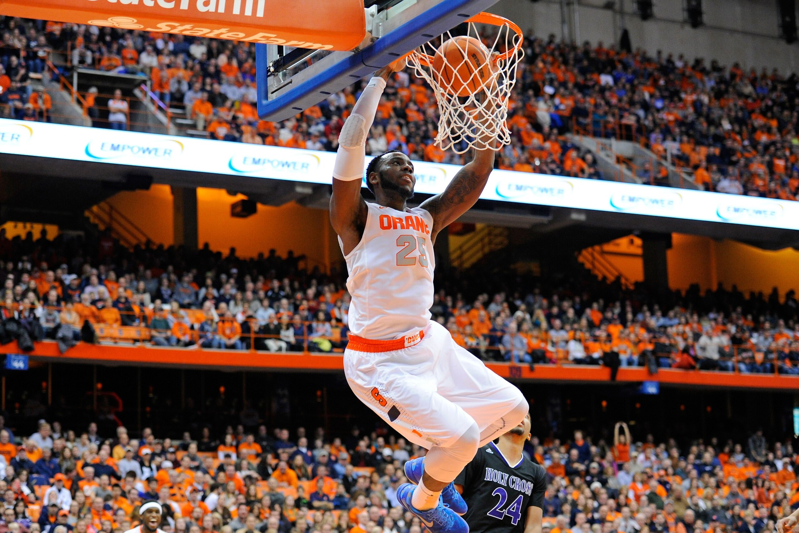 SYRACUSE, NY - NOVEMBER 28: Rakeem Christmas #25 of the Syracuse Orange dunks the ball in front of Eric Green #24 of the Holy Cross Crusaders during the second half at the Carrier Dome on November 28, 2014 in Syracuse, New York. Syracuse defeated Holy Cross 72-48. (Photo by Rich Barnes/Getty Images) SYRACUSE, NY - NOVEMBER 28: Rakeem Christmas #25 of the Syracuse Orange dunks the ball in front of Eric Green #24 of the Holy Cross Crusaders during the second half at the Carrier Dome on November 28, 2014 in Syracuse, New York. Syracuse defeated Holy Cross 72-48. (Photo by Rich Barnes/Getty Images)