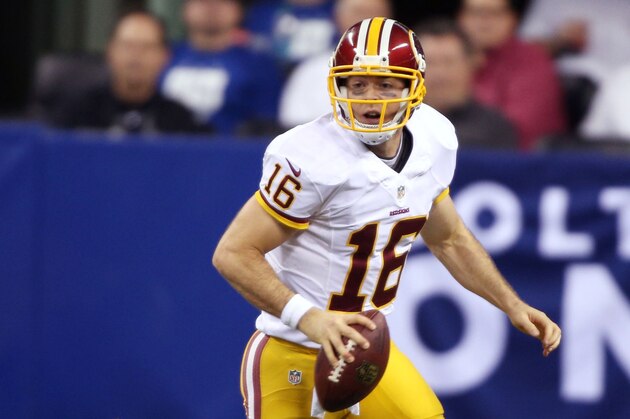 Nov 30, 2014; Indianapolis, IN, USA; Washington Redskins quarterback Colt McCoy (16) rolls out to throw a pass against the Indianapolis Colts at Lucas Oil Stadium. Mandatory Credit: Brian Spurlock-USA TODAY Sports