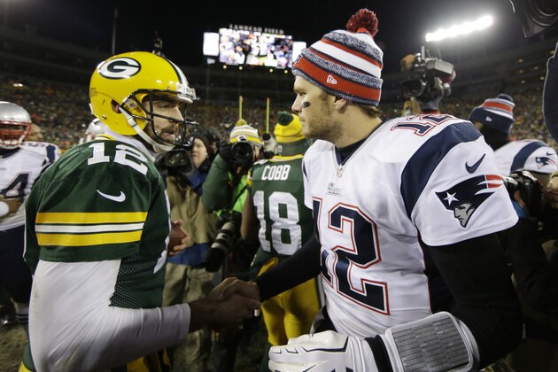 Green Bay Packers' Aaron Rodgers shakes hands with New England Patriots' Tom Brady after an NFL football game Sunday, Nov. 30, 2014, in Green Bay, Wis. The Packers won 26-21. (AP Photo/Tom Lynn)