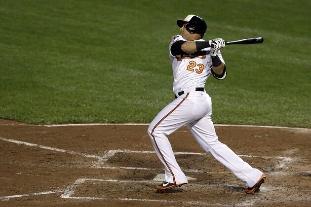 Baltimore Orioles' Nelson Cruz singles in the third inning of a baseball game against the Toronto Blue Jays, Monday, Sept. 15, 2014, in Baltimore. Adam Jones scored on the play. (AP Photo/Patrick Semansky)