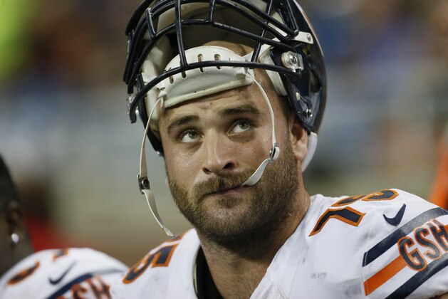 Chicago Bears guard Kyle Long looks towards the scoreboard during the first half of an NFL football game against the Detroit Lions in Detroit, Thursday, Nov. 27, 2014. (AP Photo/Paul Sancya)