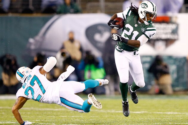 EAST RUTHERFORD, NJ - DECEMBER 01: Chris Johnson #21 of the New York Jets runs the ball against Jimmy Wilson #27 of the Miami Dolphins during their game at MetLife Stadium on December 1, 2014 in East Rutherford, New Jersey. (Photo by Al Bello/Getty Images) EAST RUTHERFORD, NJ - DECEMBER 01: Chris Johnson #21 of the New York Jets runs the ball against Jimmy Wilson #27 of the Miami Dolphins during their game at MetLife Stadium on December 1, 2014 in East Rutherford, New Jersey. (Photo by Al Bello/Getty Images)