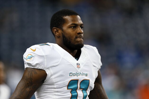 Miami Dolphins wide receiver Mike Wallace stretches during warmups before a NFL football game against the Detroit Lions in Detroit Sunday, Nov. 9, 2014. (AP Photo/Paul Sancya) Miami Dolphins wide receiver Mike Wallace stretches during warmups before a NFL football game against the Detroit Lions in Detroit Sunday, Nov. 9, 2014. (AP Photo/Paul Sancya)