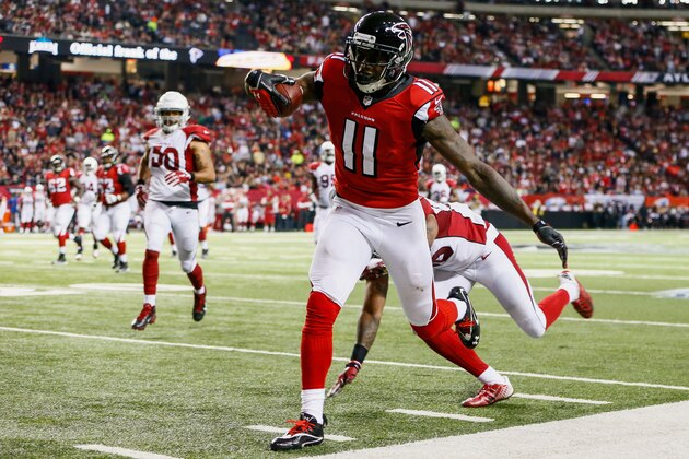 ATLANTA, GA - NOVEMBER 30: Julio Jones #11 of the Atlanta Falcons catches a pass during the first half against the Arizona Cardinals at the Georgia Dome on November 30, 2014 in Atlanta, Georgia.  (Photo by Kevin C. Cox/Getty Images)