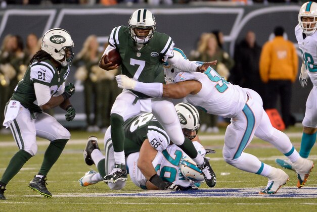 Dec 1, 2014; East Rutherford, NJ, USA; Miami Dolphins defensive end Olivier Vernon (50) sacks New York Jets quarterback Geno Smith (7) during the fourth quarter at MetLife Stadium. Mandatory Credit: Robert Deutsch-USA TODAY Sports