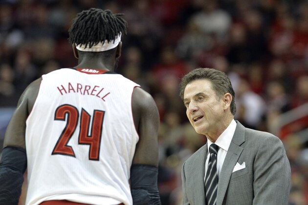 Louisville head coach Rick Pitino, right, talks with Montrezl Harrell during the first half of an NCAA college basketball game against Marshall, Friday, Nov. 21, 2014, in Louisville, Ky. (AP Photo/Timothy D. Easley)