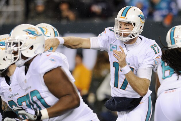 Miami Dolphins quarterback Ryan Tannehill (17) throws against the New York Jets during the first quarter of an NFL football game, Monday, Dec. 1, 2014, in East Rutherford, N.J. (AP Photo/Bill Kostroun)