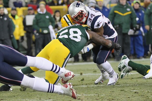 GREEN BAY, WI - NOVEMBER 30:  Inside linebacker Sam Barrington #58 of the Green Bay Packers hits running back Shane Vereen #34 of the New England Patriots in the second quarter at Lambeau Field on November 30, 2014 in Green Bay, Wisconsin.  (Photo by Mike McGinnis/Getty Images)