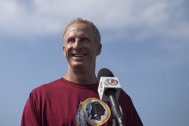 Washington Redskins' Defensive Coordinator Jim Haslett smiles during a news conference during NFL football minicamp at Redskins Park, Wednesday, June 12, 2013, in Ashburn, Va. (AP Photo/Carolyn Kaster)