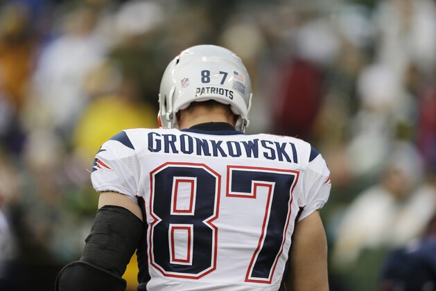 New England Patriots' Rob Gronkowski warms up before an NFL football game against the Green Bay Packers Sunday, Nov. 30, 2014, in Green Bay, Wis. (AP Photo/Tom Lynn)