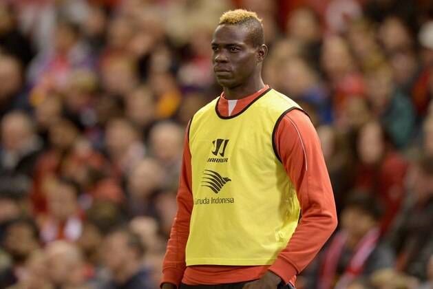 LIVERPOOL, ENGLAND - OCTOBER 28:  Mario Balotelli of Liverpool watches from the sidelines during the Capital One Cup Fourth Round match between Liverpool and Swansea City at Anfield on October 28, 2014 in Liverpool, England.  (Photo by Gareth Copley/Getty Images)